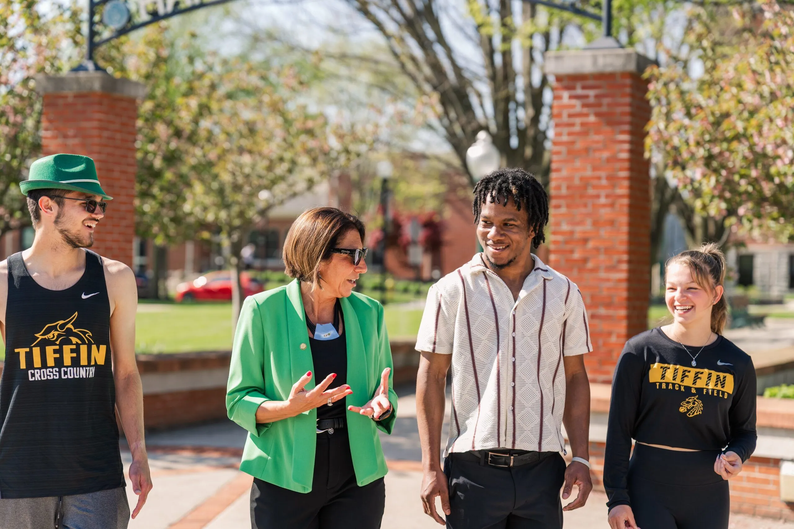 University president with a group of smiling students