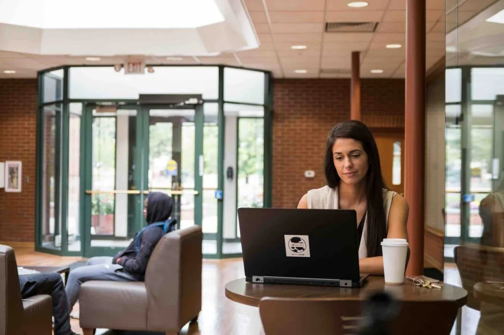 student on laptop in franks