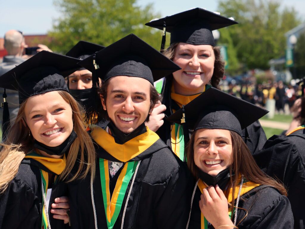 group of graduates in caps and gowns