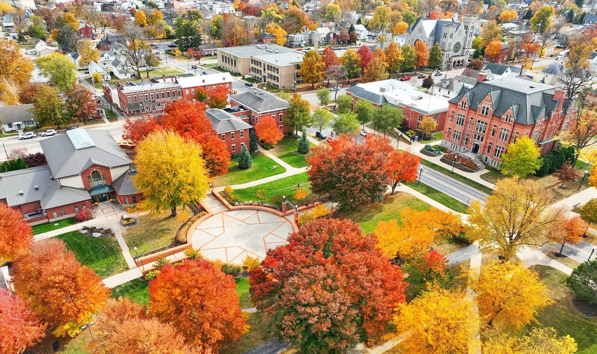 a scenic photo of campus in the fall from the drone