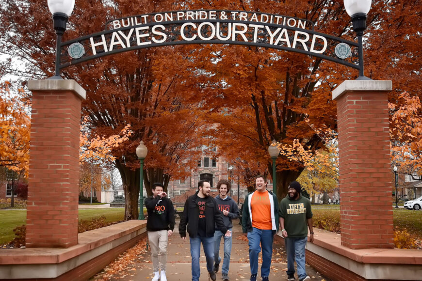 hayes courtyard sign on Fall day with students