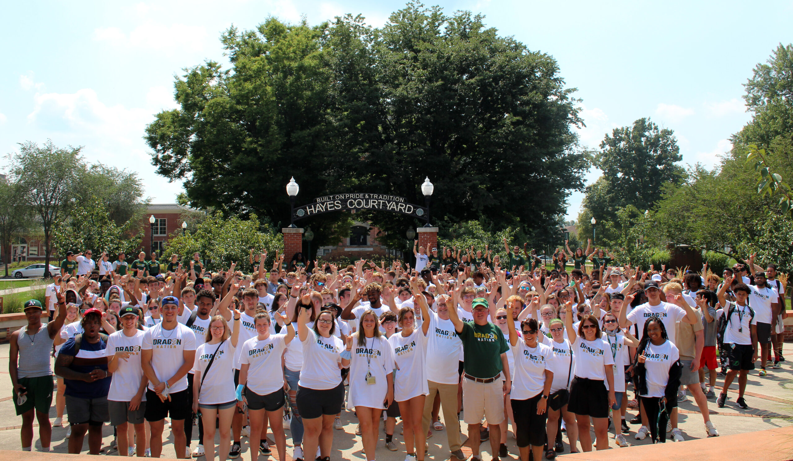 college students and staff group shot outdoors