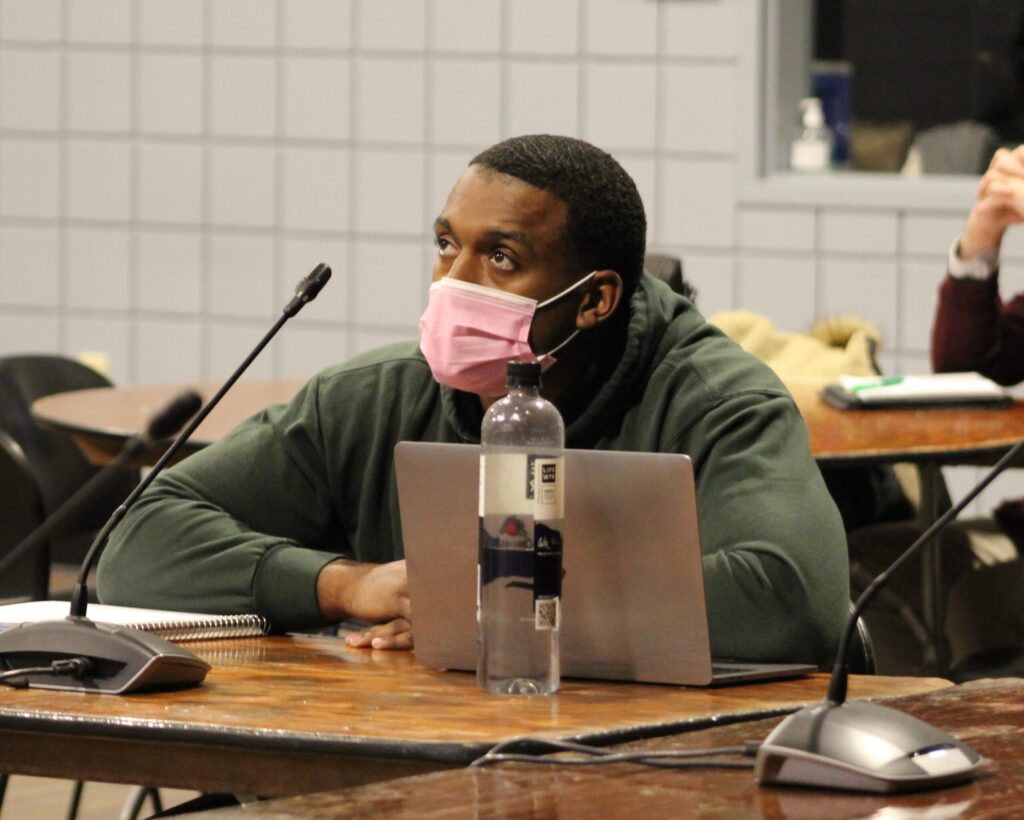 student in class with laptop