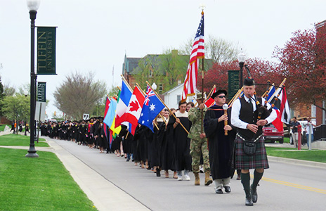 bag piper leading graduation procession