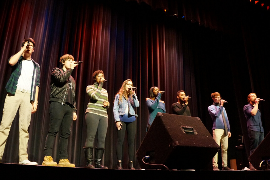 students singing on stage