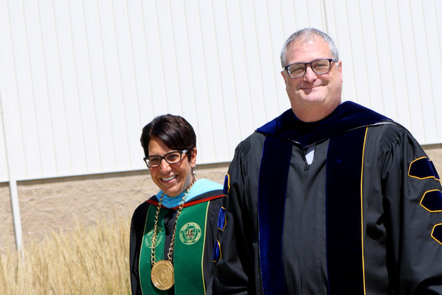 president schumacher and peter holbrook in robes at convocation