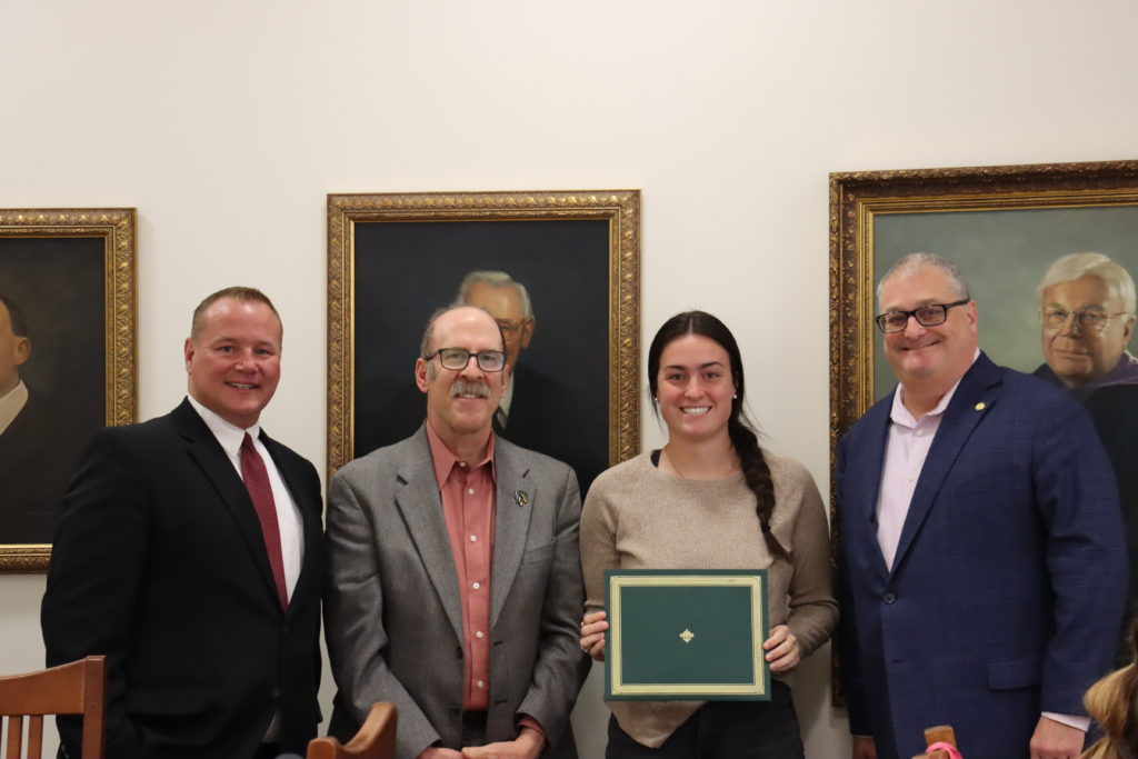 kennedy rorar with the cold case faculty smiling