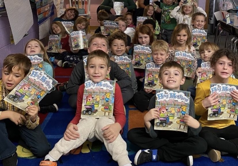 a class of young students with books