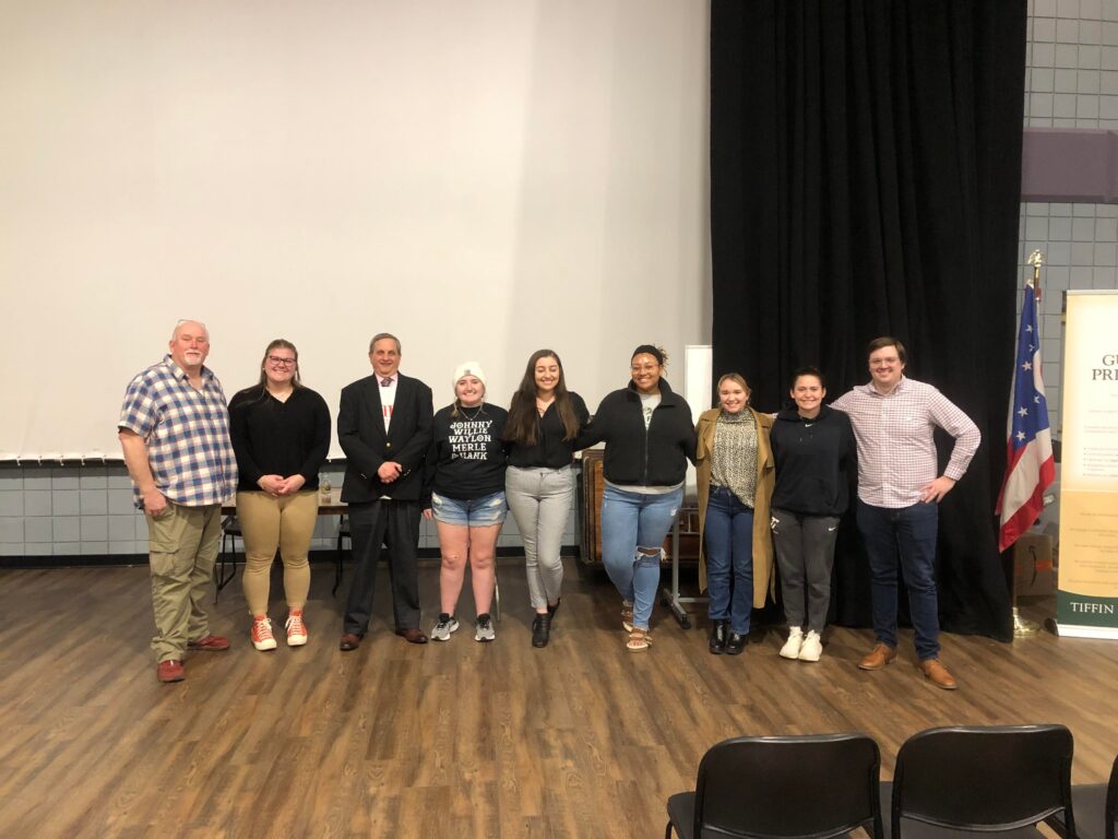 Group of OIP members with speaker