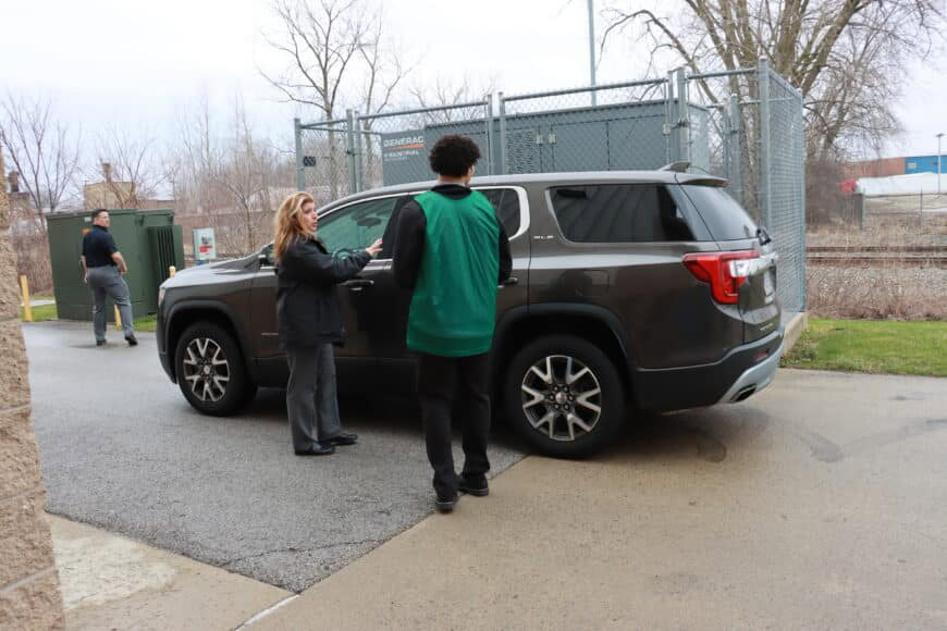 student walking towards a car during the secret service event