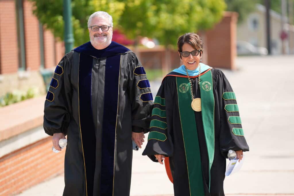 president schumacher and the provost smiling