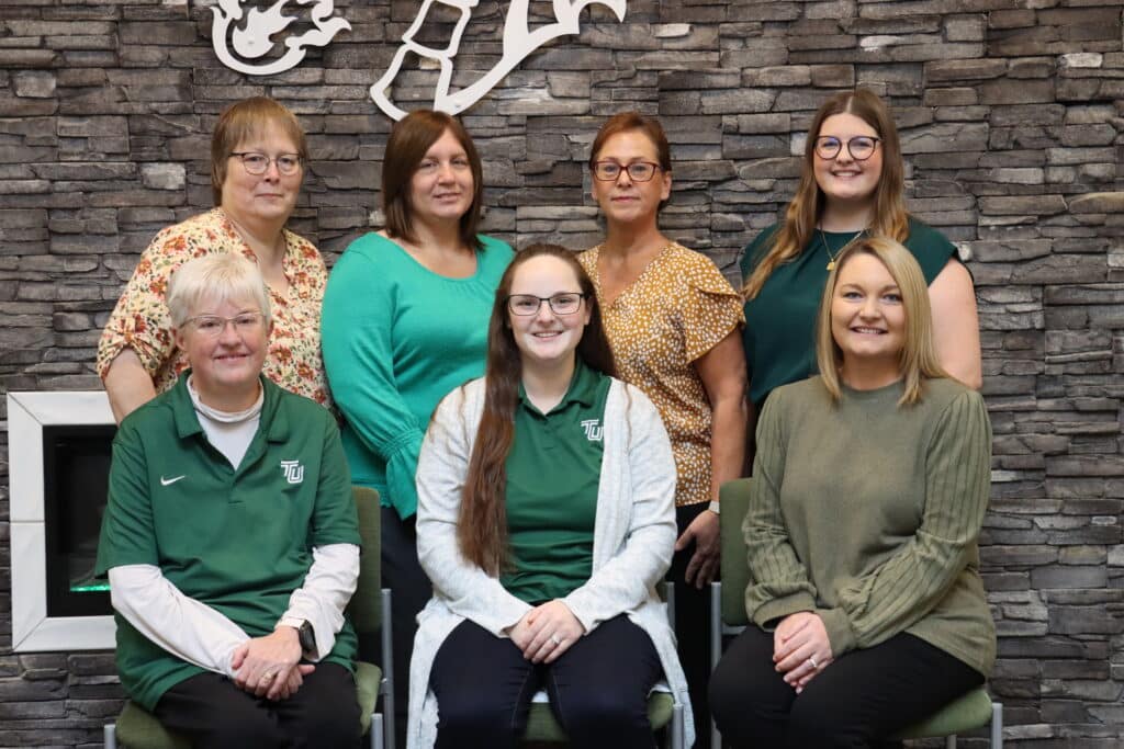 financial aid staff group photo smiling