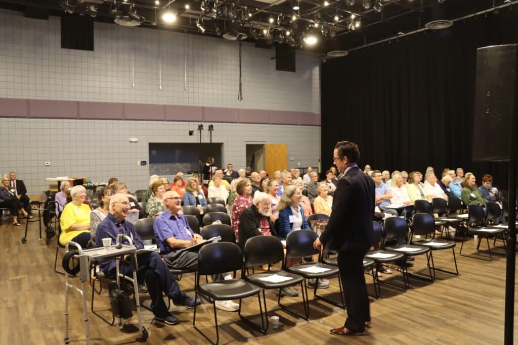 large group of life@tu participants listening to a speaker