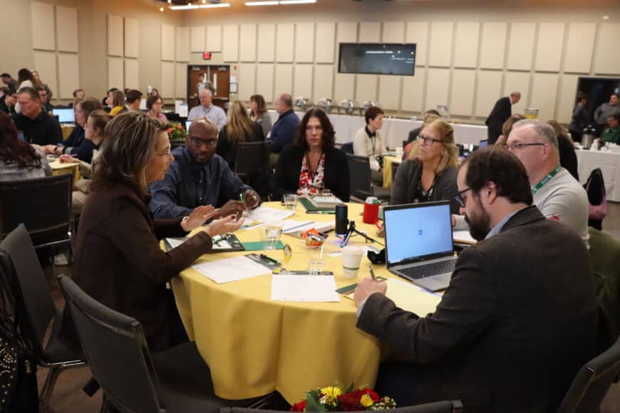 tables full of people at the innovation summit