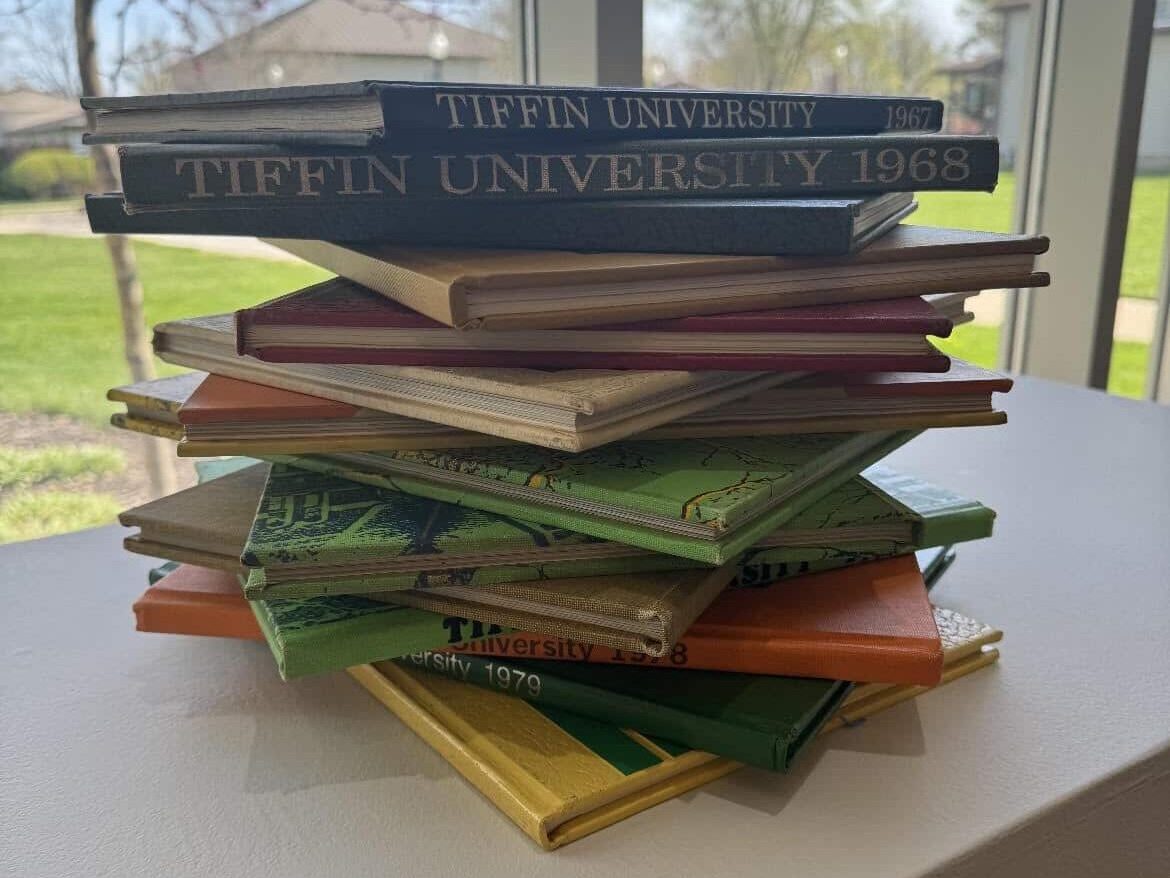 Stack of Tiffin University books located in Diane Kidd Art Gallery