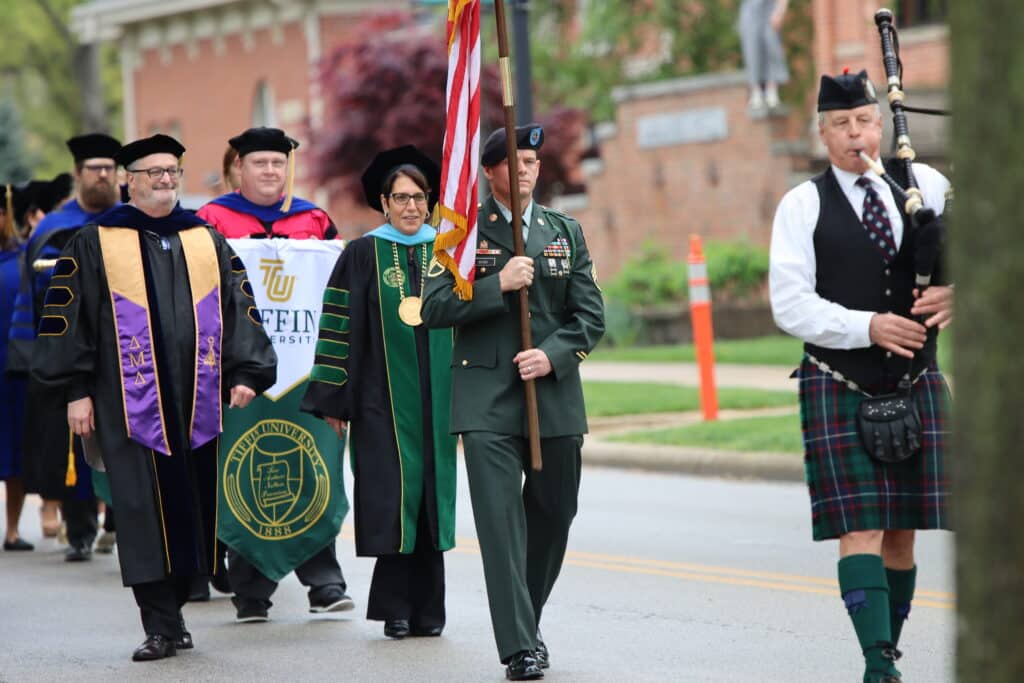 front of the graduation procession