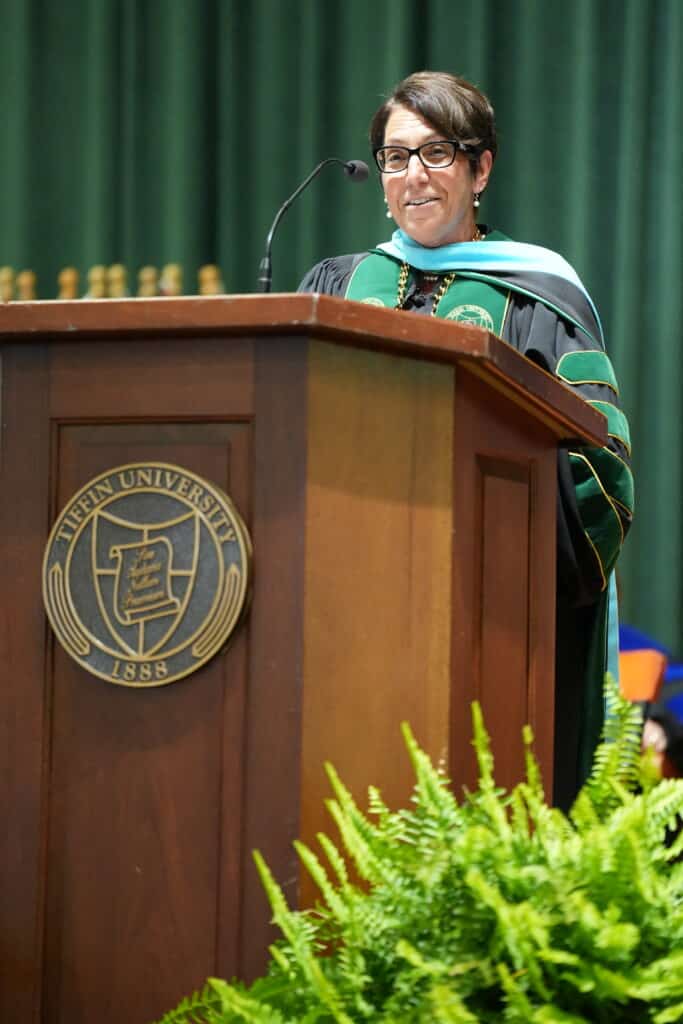 dr. schumacher speaking in ceremony