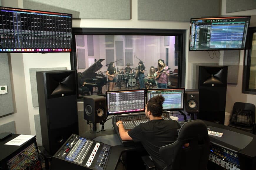 Student working at a state-of-the-art digital media recording studio at TU