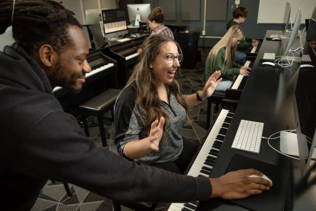 Commercial Music student and professor in piano lab