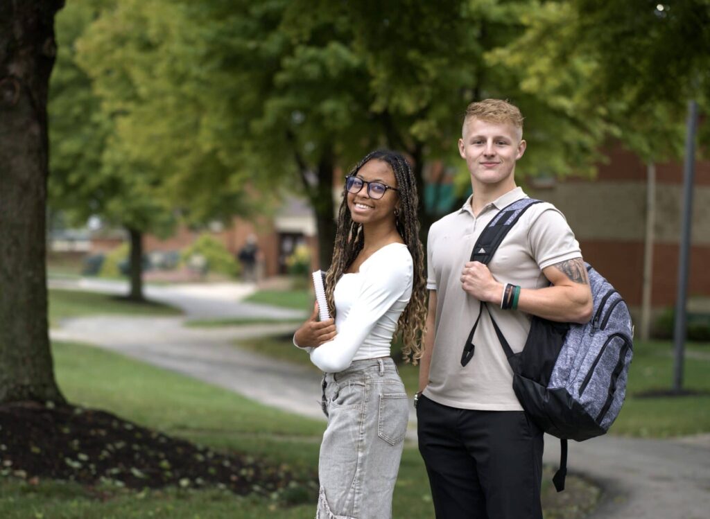 students on campus path at TU