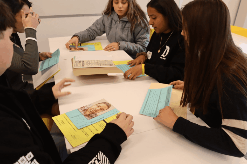 Cold Case Summer Camp students reviewing case files