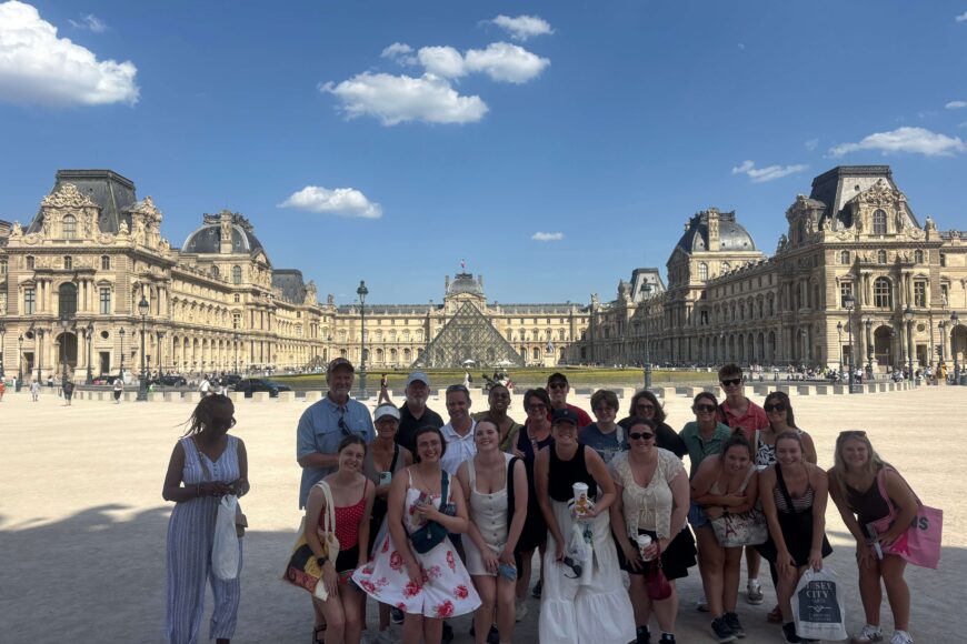 TU travelers in front of the Louvre