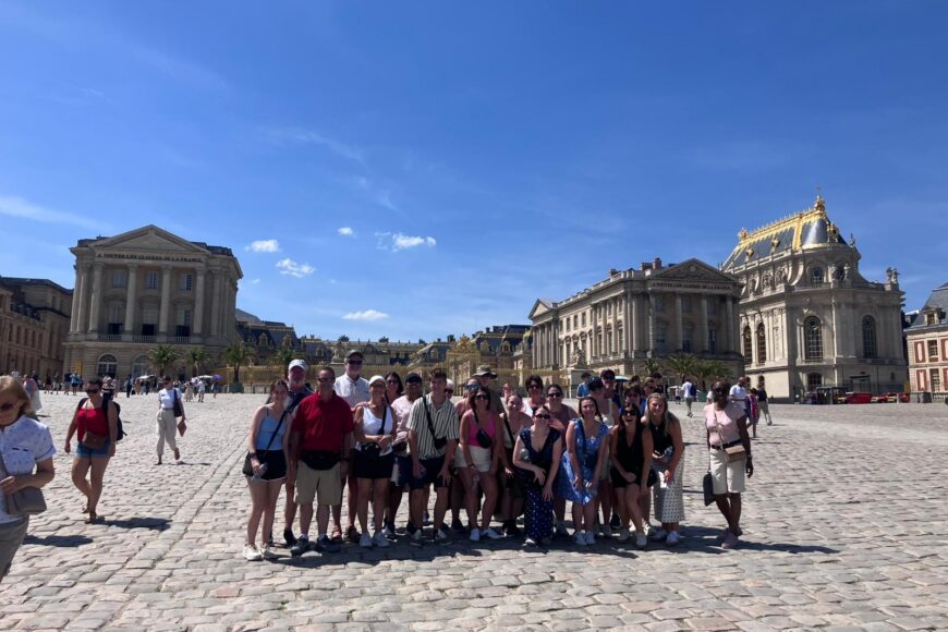 TU travelers in front of Palace of Versailles