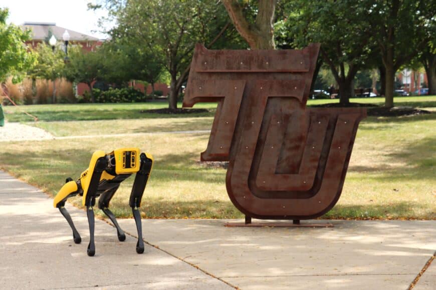 robotic dog, spot, near TU sign