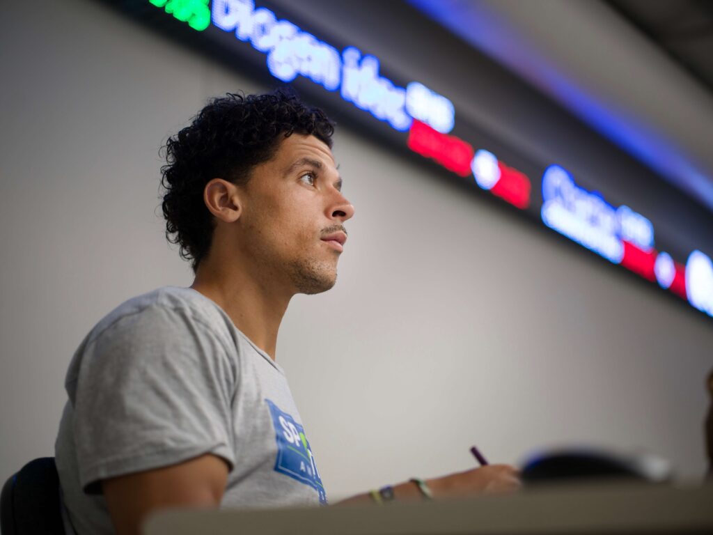 business school student with stock ticker