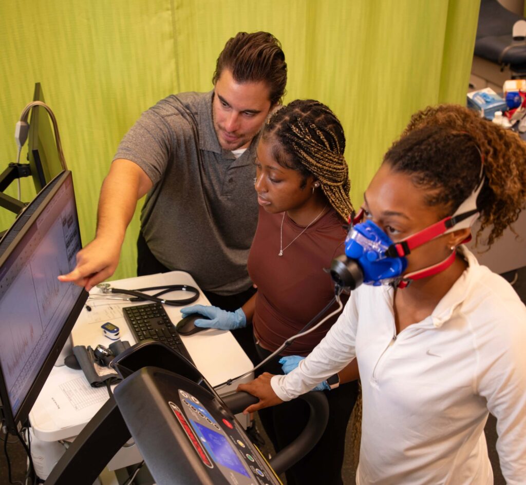 Professor teaching exercise science class and how to become an athletic trainer