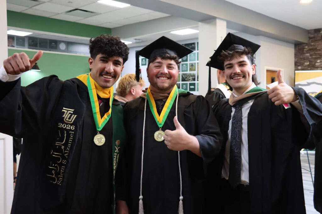 happy guys at graduation
