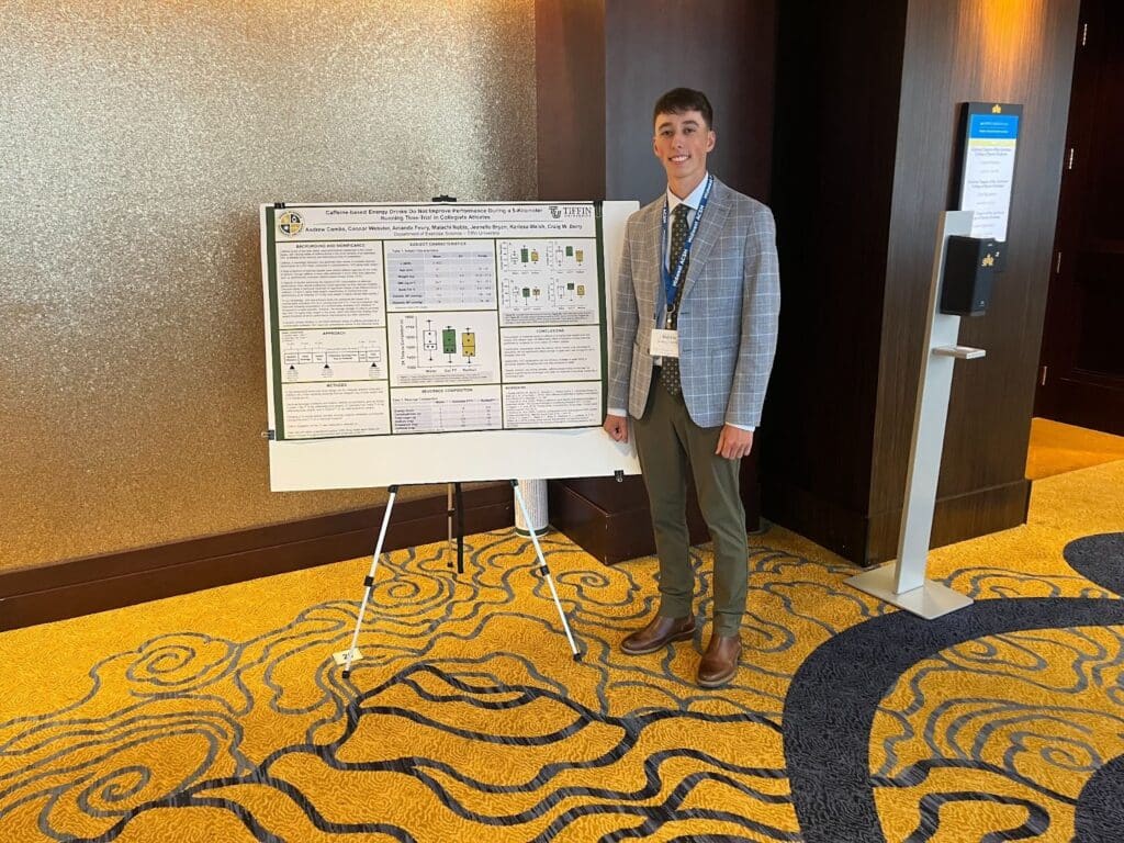 Clinical Exercise Physiology master’s student, Andrew Combs, preparing to present his research poster