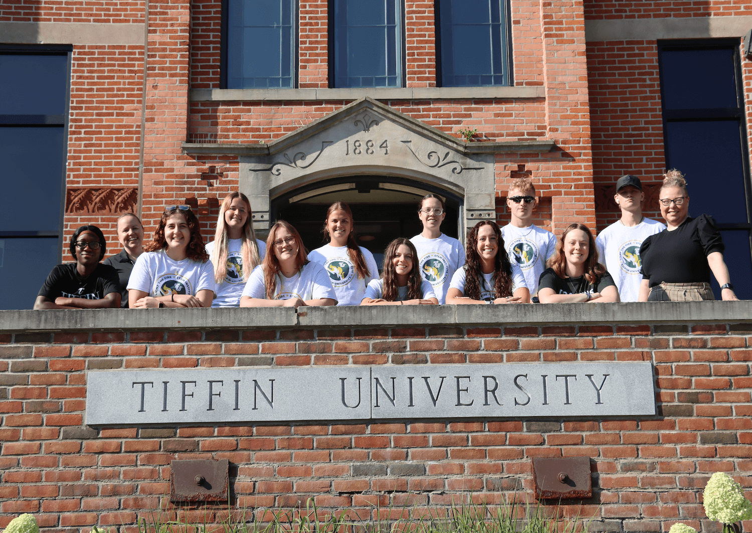 group of stem institute attendees on steps of main