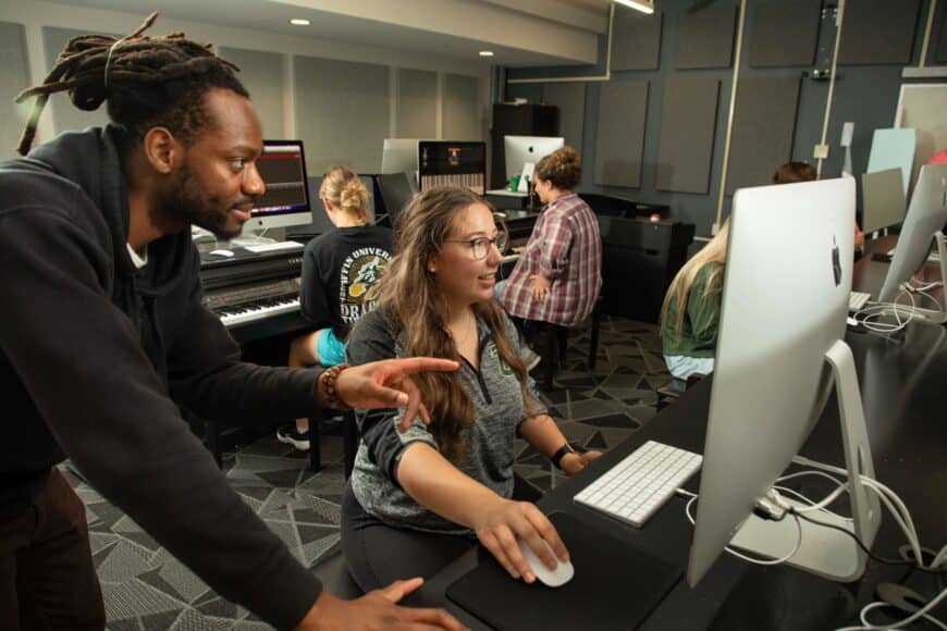 professor and student in piano lab