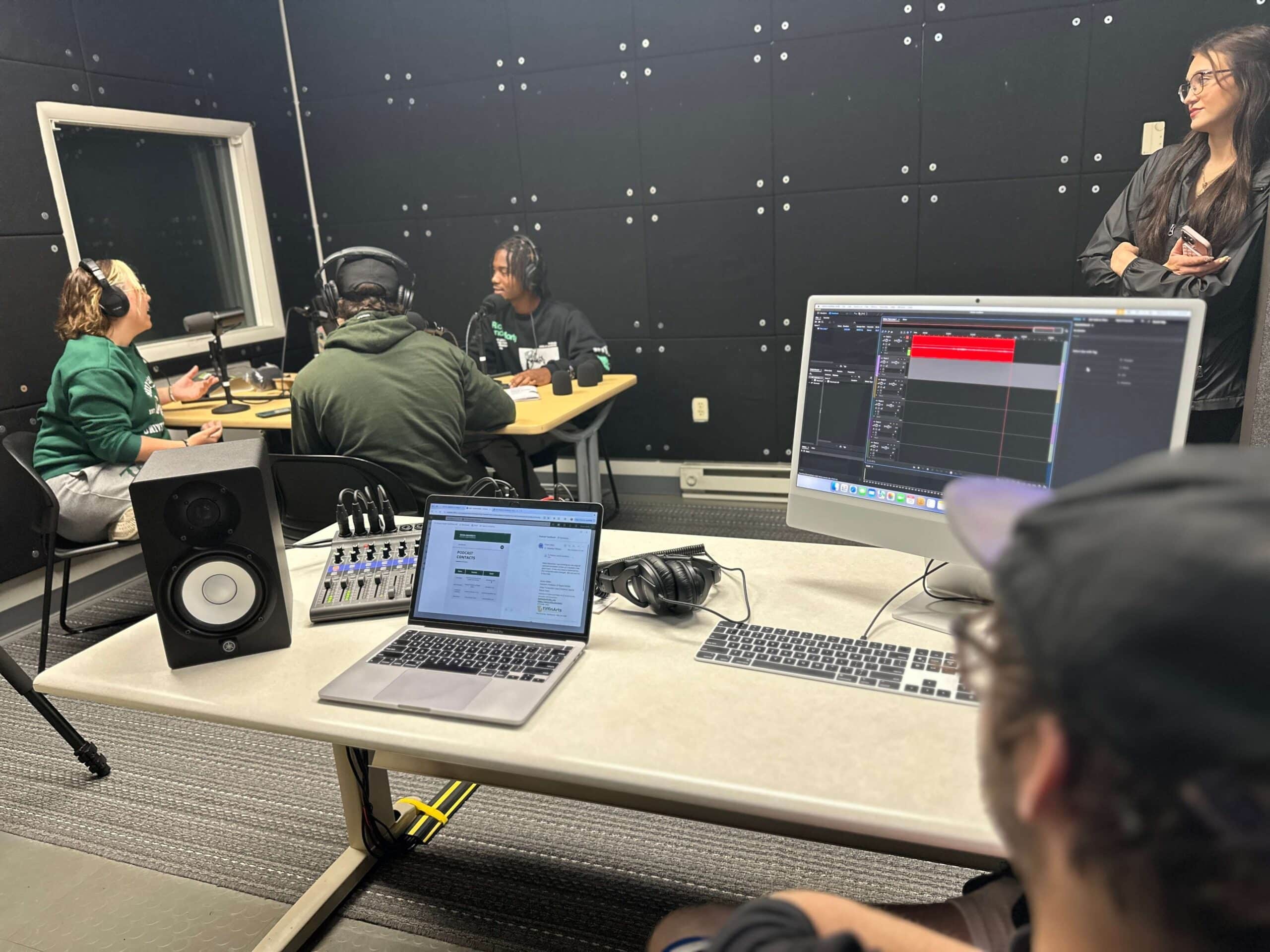 sports media team recording a podcast