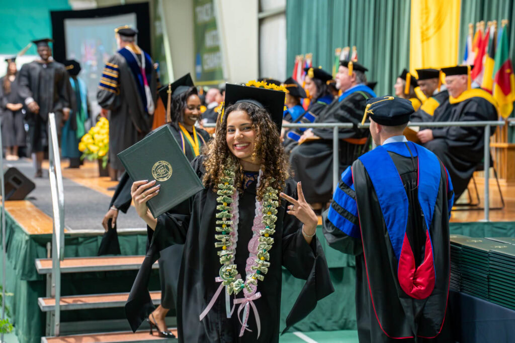 graduate after walking across stage